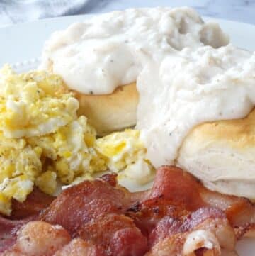 breakfast with bacon gravy biscuits and eggs