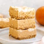 no bake pumpkin cheesecake bars stacked in a set of three