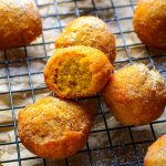 light and fluffy pumpkin fritter with a bite taken out