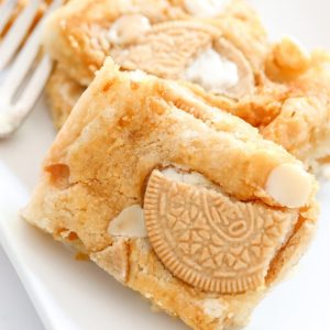 oreo pumpkin blondies on a plate with a fork