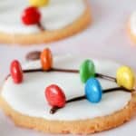 christmas light cookies with frosting and m&ms on top