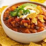 thick and rich smoky chili topped with cilantro avocado and served with golden tortilla chips