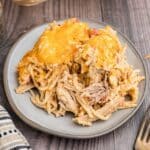 chicken baked spaghetti on a plate with a fork