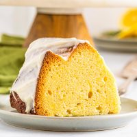 slice of moist lemon pound cake with glaze