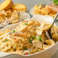 cajun chicken pasta in a serving dish with fork