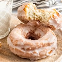 old fashioned, crackled sour cream donuts with a glass of milk