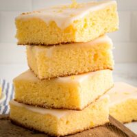 stack of four lemon brownies on a cutting board