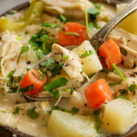 chicken potato soup in a bowl with a spoon