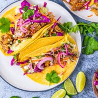 street carnitas with red onion, lime and cilantro garnish